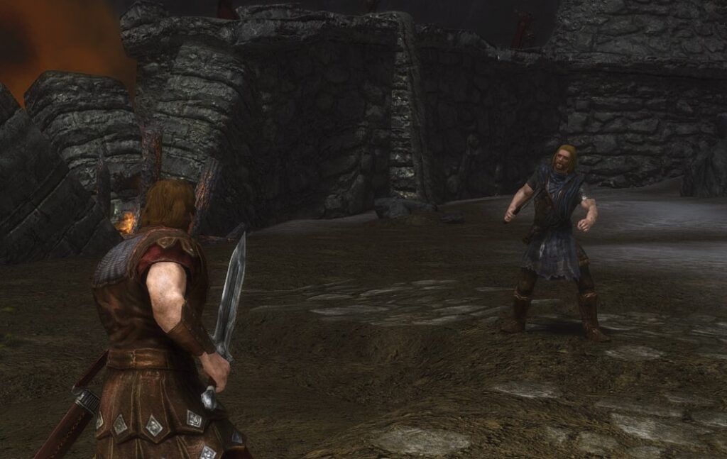 Hadvar and Ralof face to face wielding weapons in a dark village.