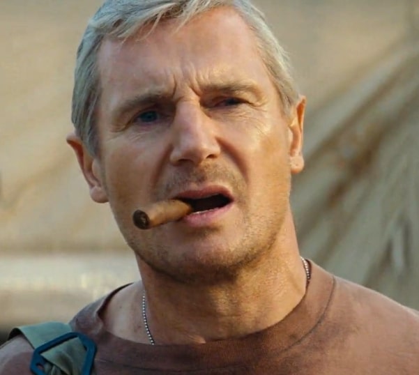 Liam Neeson smoking a cigar with with a confused face in The A-Team.