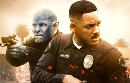 Will Smith and a blue orc holding weapons as policemen in the scorching sunshine in Bright.