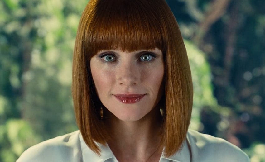 Claire Dearing with short red hair and red lips looking straight forward.