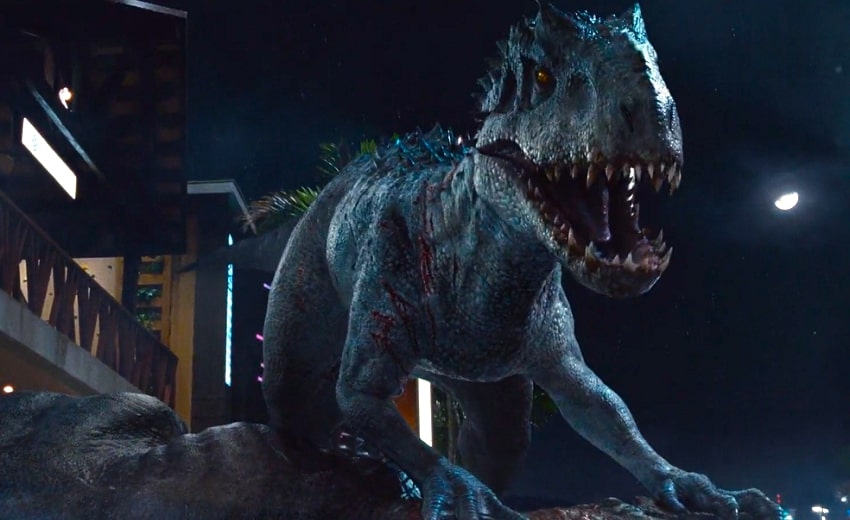 Indominus Rex on top of Tyrannosaurus Rex in the dark in Jurassic World.