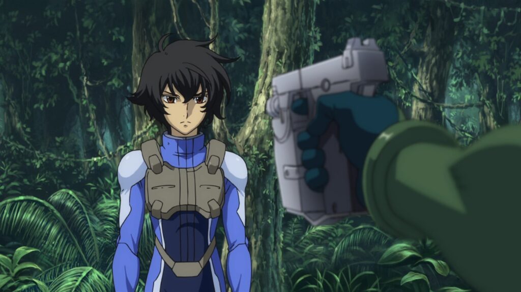 Setsuna F Seiei looking serious while having a gun pointed at him in the jungle.